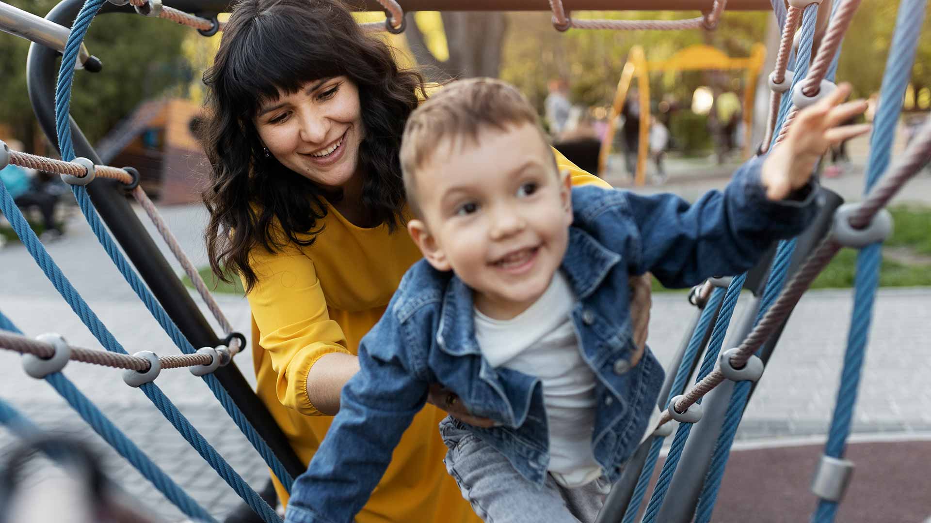 Parent supervising child on playground