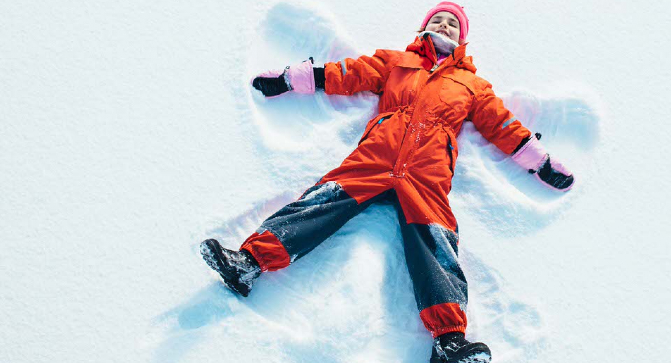 Child making snow angels