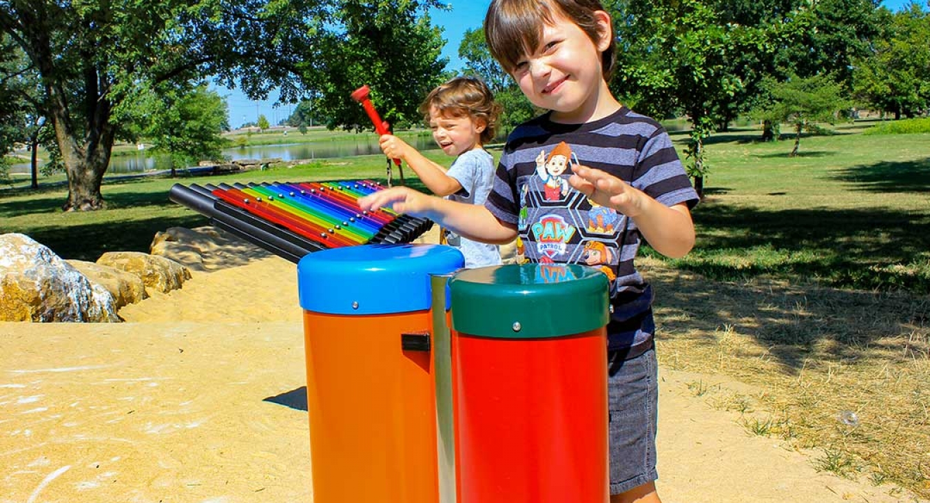 children playing on a musical playground