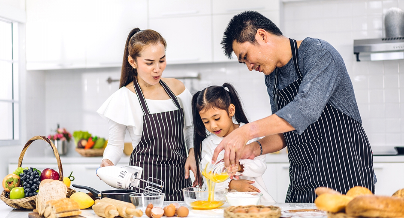 family cooking a meal together