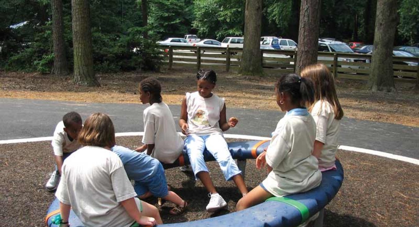children playing on play equipment