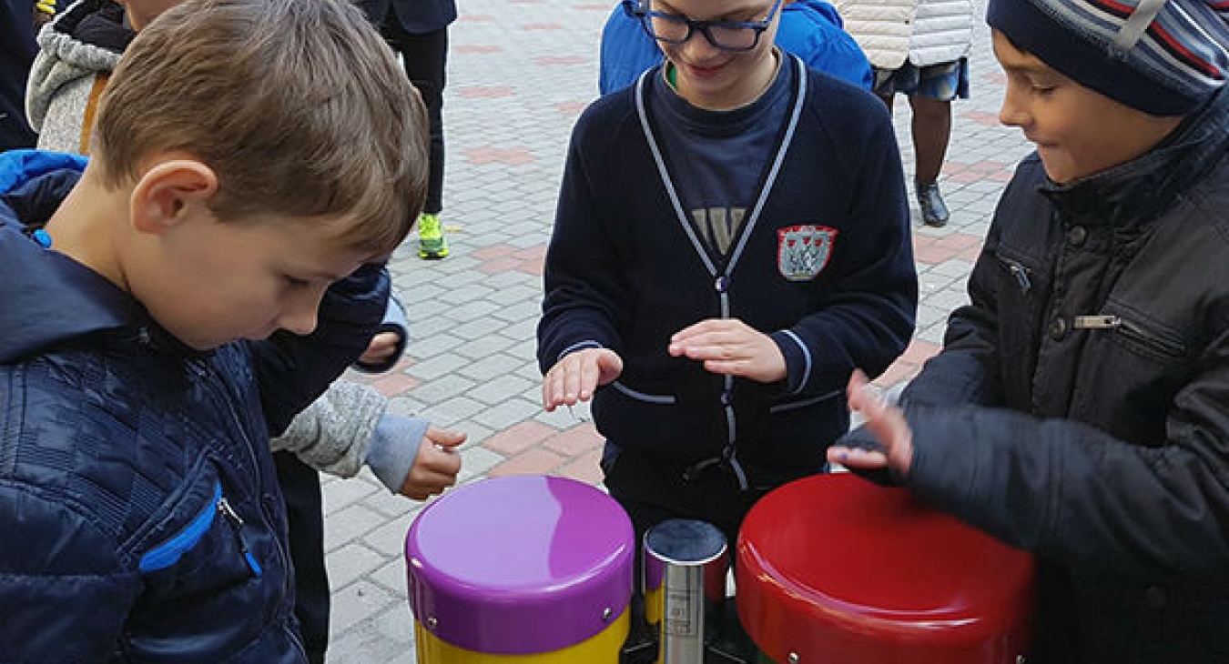 Boys playing conga drums