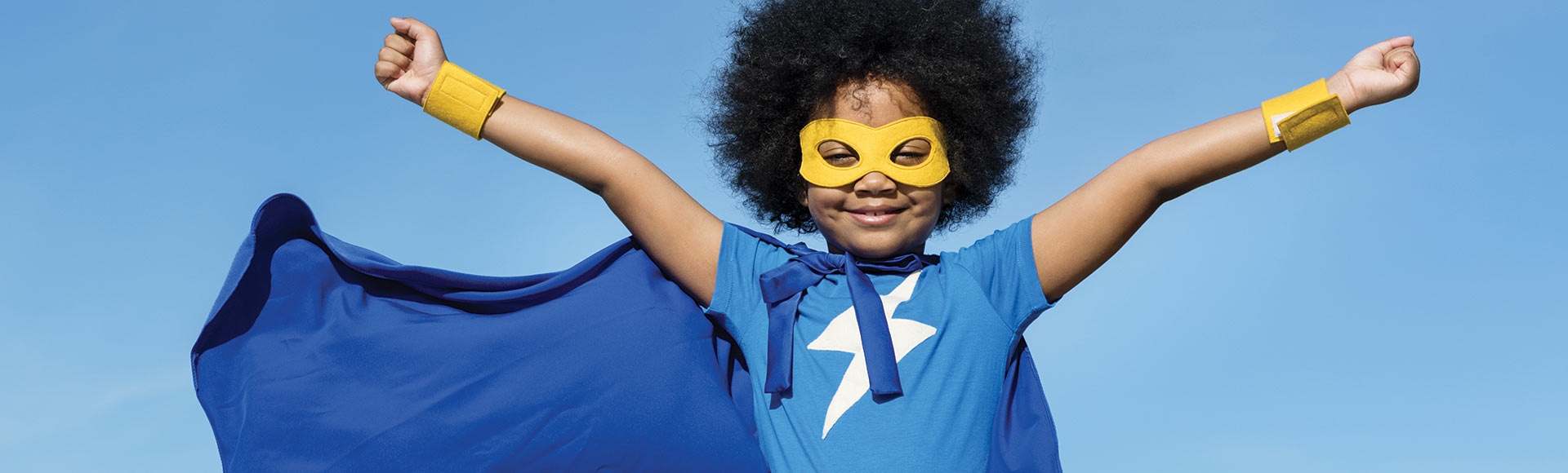 child dressed as a super hero