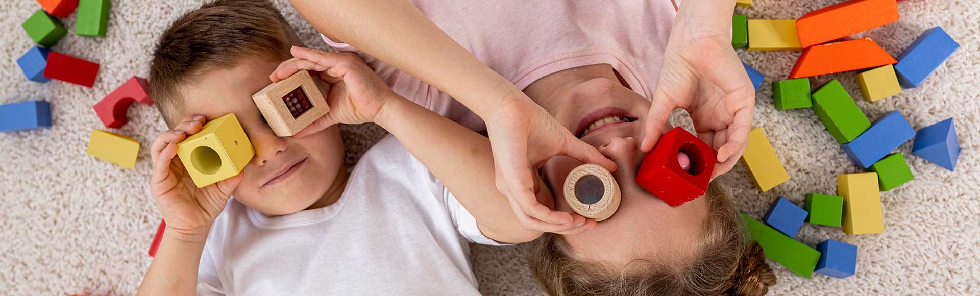 brother and sister playing with blocks